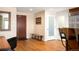 Entryway with hardwood floors, bench, and a view into the kitchen at 1411 Wynkoop St # 804, Denver, CO 80202