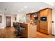 Bright kitchen with stainless steel appliances, a large island with bar stool seating, and hardwood floors at 1411 Wynkoop St # 804, Denver, CO 80202