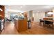 Open kitchen and dining area with a center island, breakfast bar, and city views at 1411 Wynkoop St # 804, Denver, CO 80202