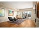 Bright and airy living area showcasing modern decor, hardwood flooring, and a view of the city skyline at 1411 Wynkoop St # 804, Denver, CO 80202