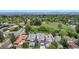 Aerial view of a house and the surrounding neighborhood filled with mature trees and manicured lawns at 220 Glencoe St, Denver, CO 80220