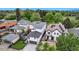An aerial view showcases the property's proximity to lush greenery at 220 Glencoe St, Denver, CO 80220