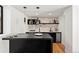 Stylish bar area with sleek countertops and marble backsplash at 220 Glencoe St, Denver, CO 80220