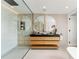 Serene bathroom with double sink vanity, stylish mirrors, and a luxurious walk-in glass shower at 220 Glencoe St, Denver, CO 80220