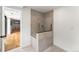 Tiled walk-in shower features modern fixtures and an open concept design at 220 Glencoe St, Denver, CO 80220