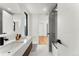 Modern bathroom featuring sleek, floating vanity, minimalist fixtures, and glass shower at 220 Glencoe St, Denver, CO 80220
