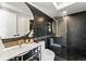 This bathroom boasts a walk-in shower and a modern vanity at 220 Glencoe St, Denver, CO 80220