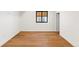 Cozy bedroom featuring hardwood floors and natural light at 220 Glencoe St, Denver, CO 80220