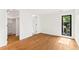 Bright bedroom boasts natural light, closet, and hardwood floors at 220 Glencoe St, Denver, CO 80220