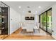 Bright dining area with modern table and chairs and access to the outdoors at 220 Glencoe St, Denver, CO 80220