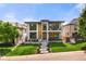 Stunning modern home featuring a manicured lawn and eye-catching architectural design at 220 Glencoe St, Denver, CO 80220