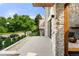 Welcoming front porch with stone accents, modern lighting, and lush landscaping at 220 Glencoe St, Denver, CO 80220