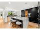 Modern kitchen featuring a large island and state-of-the-art appliances at 220 Glencoe St, Denver, CO 80220