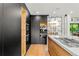 Gourmet kitchen with sleek cabinetry, modern appliances, and elegant finishes at 220 Glencoe St, Denver, CO 80220