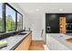 Modern kitchen features sleek cabinetry, stone countertops, stainless steel appliances, and a bright window at 220 Glencoe St, Denver, CO 80220