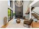 Bright living room with tall ceilings, modern fireplace, and elegant chandelier at 220 Glencoe St, Denver, CO 80220