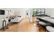 Open floor plan flows seamlessly from the kitchen to living room with hardwood floors and natural light at 220 Glencoe St, Denver, CO 80220