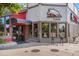 Charming restaurant with a distinctive logo, glass entrance doors and outdoor seating options at 2412 Windmill Dr, Longmont, CO 80504