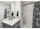 Stylish bathroom with marble tile shower, modern vanity, and matte black hardware at 1492 Red Cliff Way, Castle Rock, CO 80109