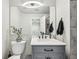 Modern bathroom featuring a gray vanity, white countertops, and sleek fixtures at 1492 Red Cliff Way, Castle Rock, CO 80109