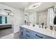 Elegant bathroom showcasing double sinks, a large mirror, and a walk-in shower, blending style and functionality at 1492 Red Cliff Way, Castle Rock, CO 80109