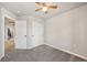 Simple bedroom with neutral carpet, closet, and interior door at 1492 Red Cliff Way, Castle Rock, CO 80109