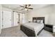 Relaxing bedroom featuring a cozy bed, barn door access to the ensuite bathroom, and ample natural light at 1492 Red Cliff Way, Castle Rock, CO 80109