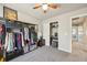 Spacious closet with a modern open shelving system, ample hanging space, and additional storage options at 1492 Red Cliff Way, Castle Rock, CO 80109