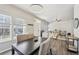 Open floor plan with a dining area featuring hardwood floors and a seamless flow into the living space at 1492 Red Cliff Way, Castle Rock, CO 80109