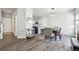 Open concept dining area with hardwood floors, modern lighting, and easy access to the kitchen at 1492 Red Cliff Way, Castle Rock, CO 80109