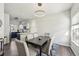 Bright dining area with contemporary lighting, hardwood floors, and views into a well-equipped kitchen at 1492 Red Cliff Way, Castle Rock, CO 80109