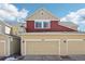 Exterior view of townhome with 2-car garage at 1492 Red Cliff Way, Castle Rock, CO 80109