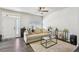 Cozy living room with ample natural light, stylish furniture, and hardwood floors for modern living at 1492 Red Cliff Way, Castle Rock, CO 80109