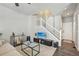 Bright living room with a staircase, neutral walls, and modern decor for a comfortable living space at 1492 Red Cliff Way, Castle Rock, CO 80109