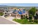 Beautiful aerial view of a home with solar panels, lush landscaping, and a picturesque neighborhood setting at 58 Rogers Ct, Golden, CO 80401