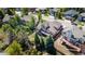 Aerial view of the backyard and deck area of the two-story home with a manicured lawn and foliage at 58 Rogers Ct, Golden, CO 80401