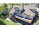 An aerial view of a home's backyard, showcasing a large deck and a well-maintained lawn at 58 Rogers Ct, Golden, CO 80401