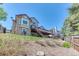 Backyard view showcasing the home's architecture, deck, and landscaped surroundings at 58 Rogers Ct, Golden, CO 80401
