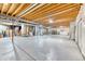 Spacious unfinished basement with concrete floor, exposed ceiling and mechanical equipment at 58 Rogers Ct, Golden, CO 80401
