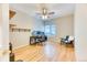 Bright bedroom with hardwood floors, fan, window and shelves is ideal for a home office or guest room at 58 Rogers Ct, Golden, CO 80401