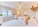 Cozy bedroom with carpet, ceiling fan and a window is perfect for or guests at 58 Rogers Ct, Golden, CO 80401