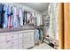 Organized walk-in closet features ample shelving, hanging rods, and a white dresser for storing clothes and accessories at 58 Rogers Ct, Golden, CO 80401