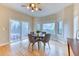 Dining room with hardwood floors, a ceiling fan, and sliding doors that lead to an outdoor area at 58 Rogers Ct, Golden, CO 80401