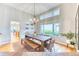Charming dining room with a wooden table, chandelier lighting, and ample natural light creating an inviting space at 58 Rogers Ct, Golden, CO 80401