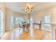 Bright dining area with hardwood floors, a ceiling fan, and big windows that provide a view to the outdoors at 58 Rogers Ct, Golden, CO 80401
