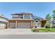 Charming two-story home with brick accents, a three-car garage, solar panels and landscaped front yard at 58 Rogers Ct, Golden, CO 80401