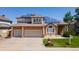 Charming two-story home with a brick facade, well-manicured lawn, and solar panels for energy efficiency at 58 Rogers Ct, Golden, CO 80401