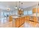 Spacious kitchen with hardwood floors, wood cabinets, and stainless steel appliances, perfect for cooking and entertaining at 58 Rogers Ct, Golden, CO 80401