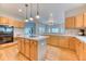 Well-equipped kitchen featuring an island, hardwood floors, and modern appliances for culinary adventures at 58 Rogers Ct, Golden, CO 80401