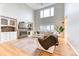 Cozy living room with a fireplace, large windows, and hardwood floors creating a warm and inviting atmosphere at 58 Rogers Ct, Golden, CO 80401